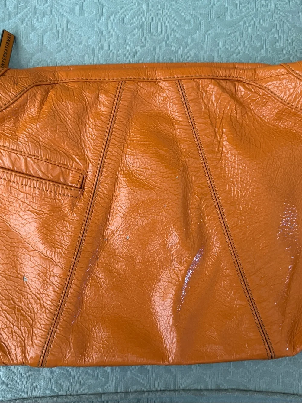 Bright orange HOBO bag